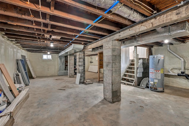below grade area featuring water heater and stairway