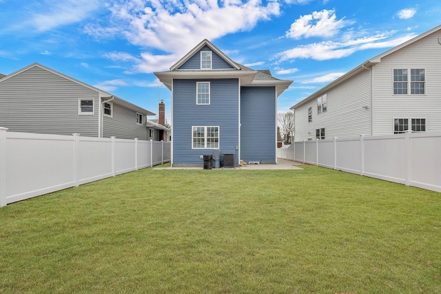 back of property featuring a fenced backyard, central AC unit, a patio area, and a lawn