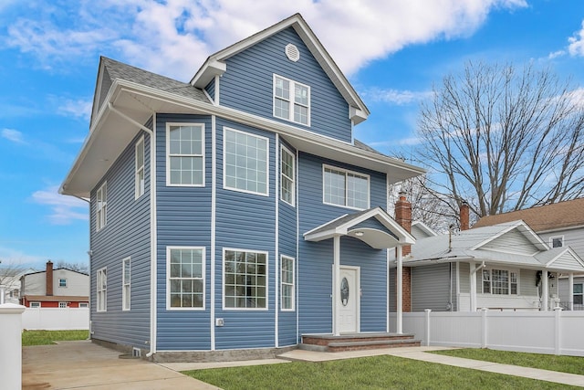 traditional style home with fence