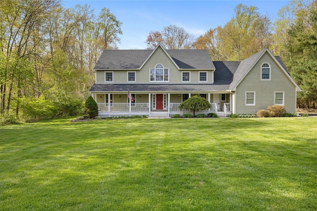 view of front facade featuring a shingled roof, a porch, and a front yard