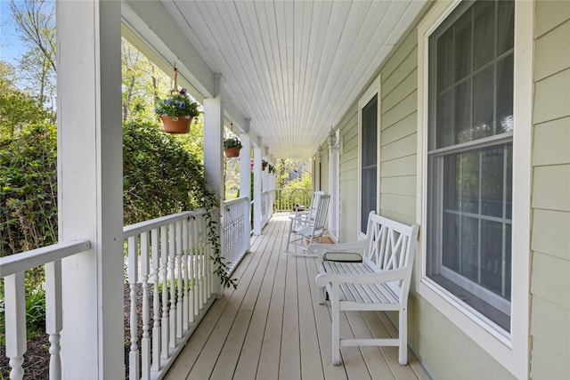 wooden terrace featuring covered porch