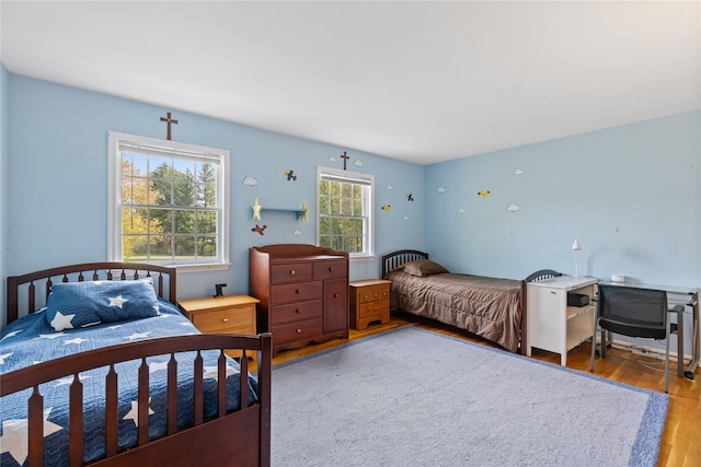 bedroom with wood finished floors