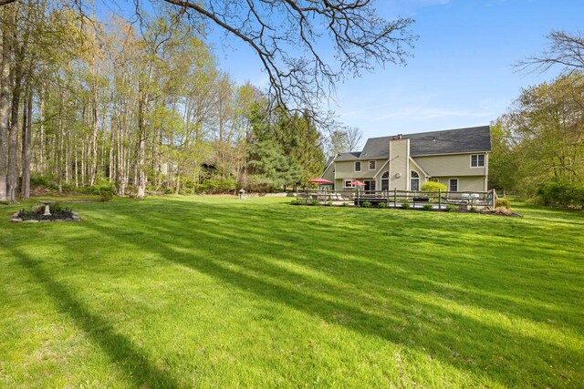 view of yard with a wooden deck