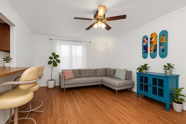 2630 Kingsbridge Ter Unit 2St, Bronx, NY 10463 - living area with light wood-type flooring, a ceiling fan, ornamental molding, and baseboards