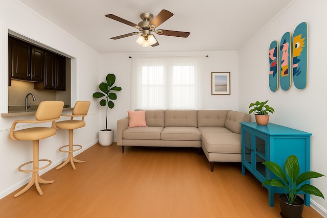 2630 Kingsbridge Ter Unit 2St, Bronx, NY 10463 - living room featuring light wood finished floors, crown molding, ceiling fan, and baseboards