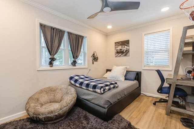 bedroom with wood finished floors, ornamental molding, baseboards, ceiling fan, and recessed lighting