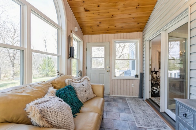 sunroom / solarium featuring lofted ceiling