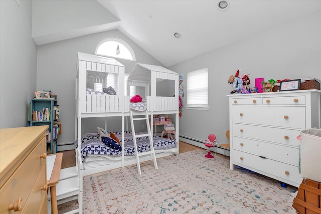 bedroom with lofted ceiling and baseboard heating