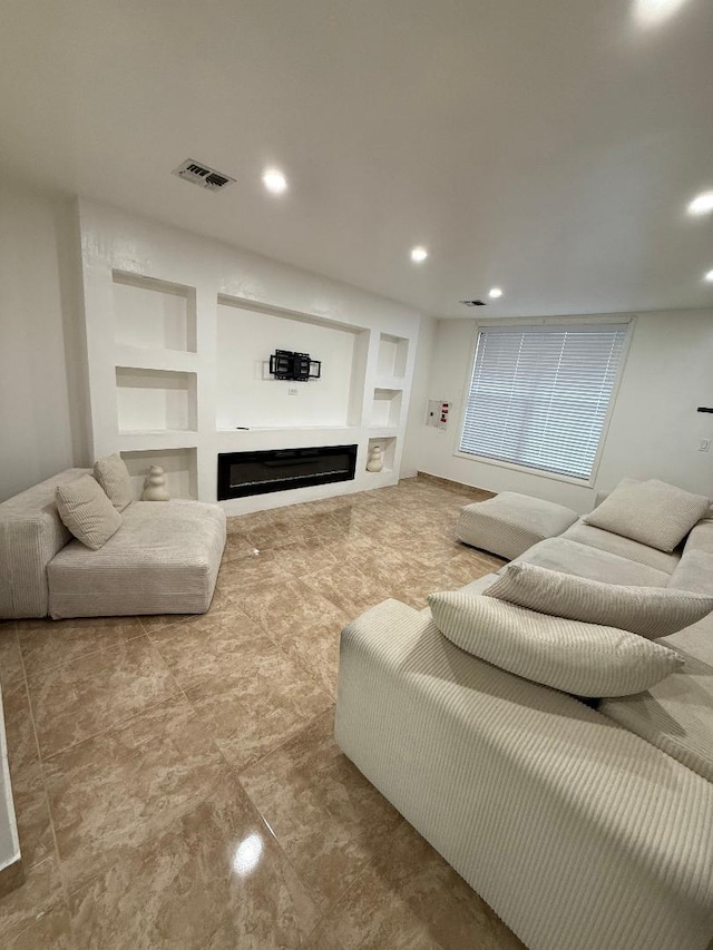 1170 Vyse Ave, Bronx, NY 10459 - living area with a glass covered fireplace, built in shelves, and recessed lighting