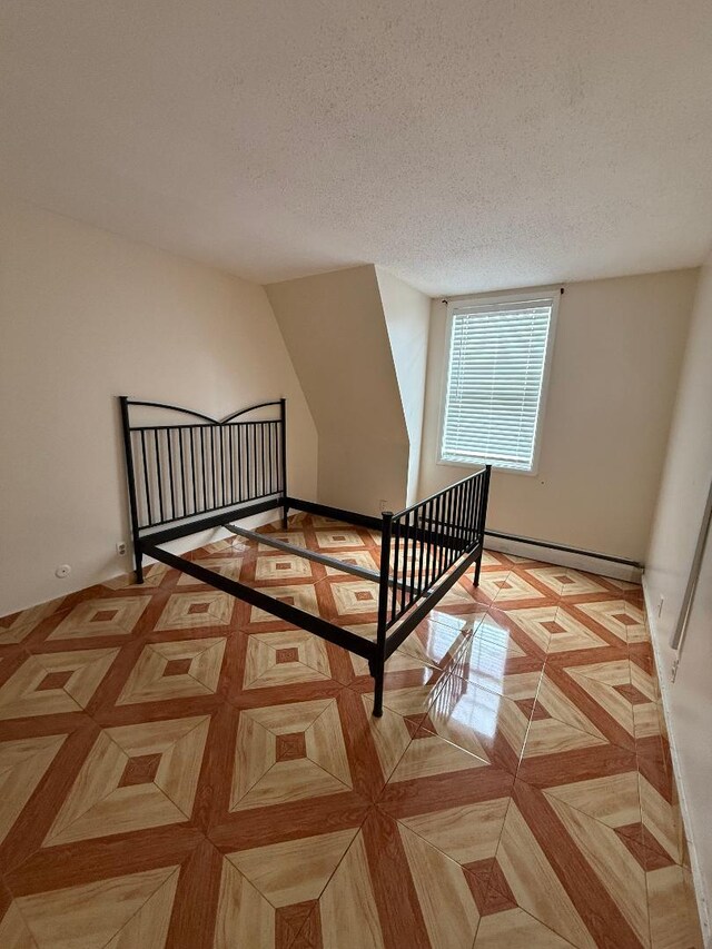 1170 Vyse Ave, Bronx, NY 10459 - stairs featuring a baseboard radiator and a textured ceiling