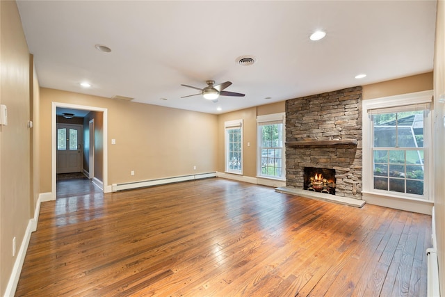 249 Cherry Ln, Airmont, NY 10901 - unfurnished living room with baseboard heating, hardwood / wood-style floors, ceiling fan, healthy amount of natural light, and recessed lighting