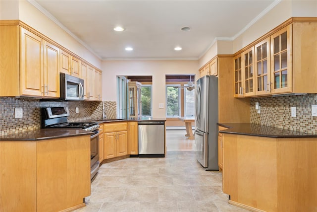 249 Cherry Ln, Airmont, NY 10901 - kitchen with stainless steel appliances, crown molding, glass insert cabinets, recessed lighting, and backsplash