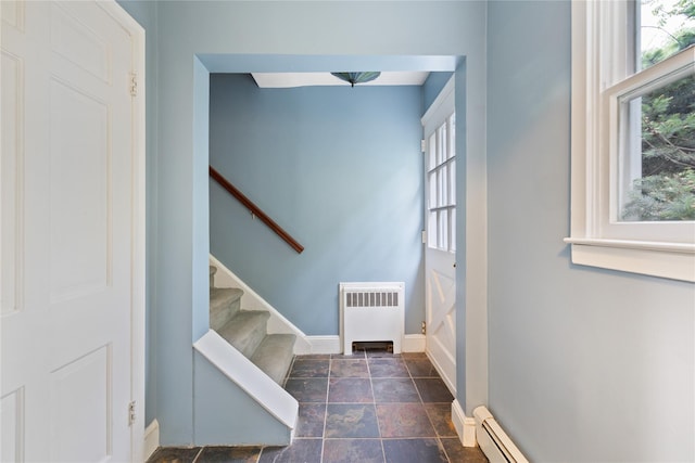 249 Cherry Ln, Airmont, NY 10901 - entryway with radiator, plenty of natural light, baseboards, and stone finish floors