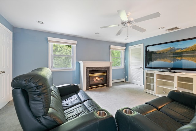 249 Cherry Ln, Airmont, NY 10901 - carpeted living area with baseboard heating, a premium fireplace, a ceiling fan, recessed lighting, and baseboards