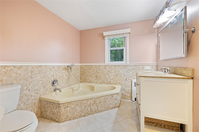 249 Cherry Ln, Airmont, NY 10901 - full bathroom featuring toilet, tile patterned floors, vanity, a bath, and wainscoting