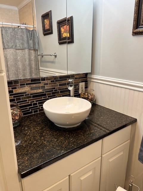 2659 Rte 52, Hopewell Junction, NY 12533 - bathroom with wainscoting, curtained shower, ornamental molding, and vanity