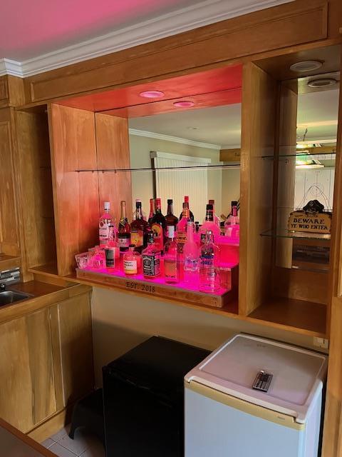 2659 Rte 52, Hopewell Junction, NY 12533 - bar featuring fridge, crown molding, and a dry bar