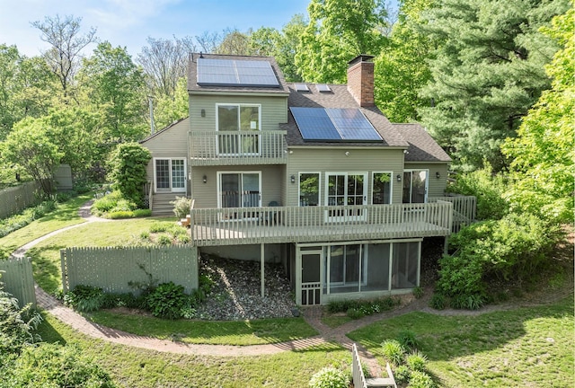 2716 Salt Point Tpke, Clinton Corners, NY 12514 - rear view of house featuring solar panels, a sunroom, a balcony, a chimney, and roof with shingles