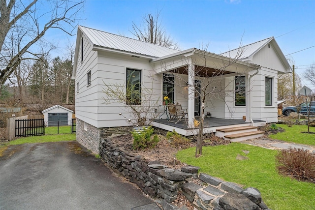 55 Upper Main St, Callicoon, NY 12723 - view of front of house featuring metal roof and covered porch