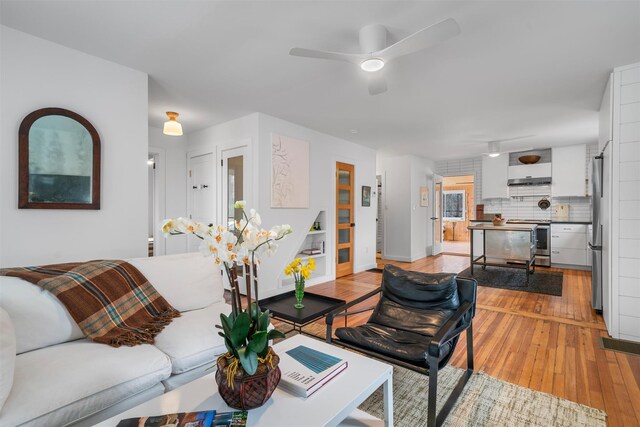 55 Upper Main St, Callicoon, NY 12723 - living area with a ceiling fan, hardwood / wood-style flooring, and baseboards