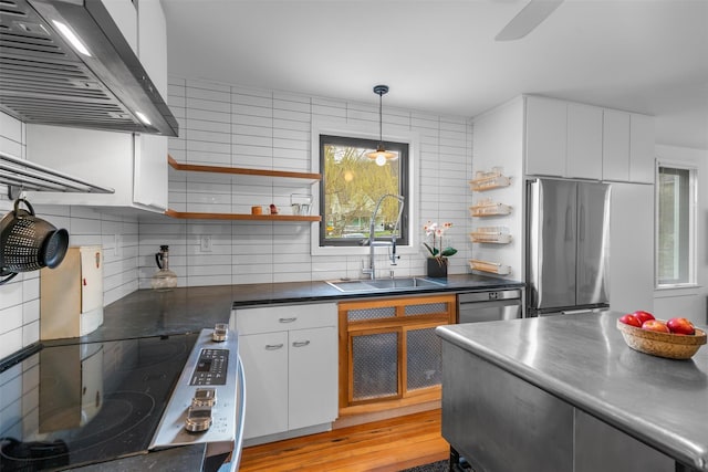 55 Upper Main St, Callicoon, NY 12723 - kitchen featuring wall chimney exhaust hood, a sink, appliances with stainless steel finishes, and open shelves