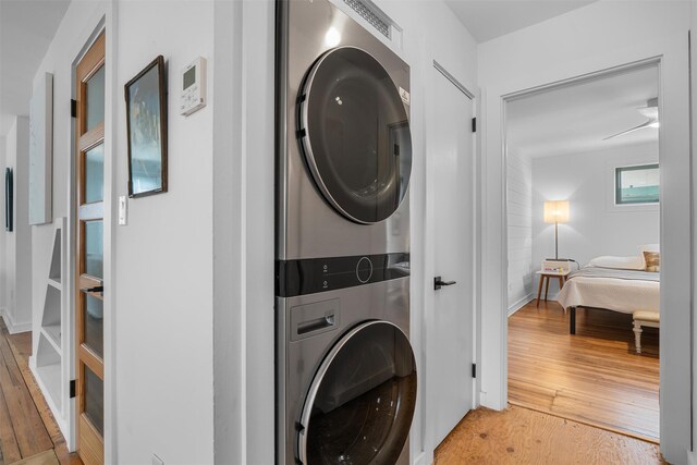 55 Upper Main St, Callicoon, NY 12723 - washroom featuring estacked washer and dryer and wood-type flooring