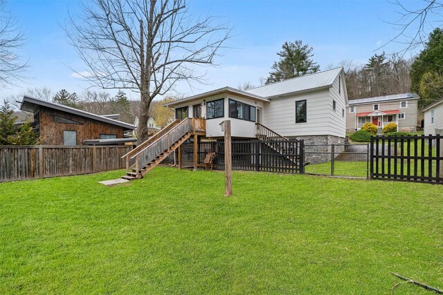 55 Upper Main St, Callicoon, NY 12723 - back of house with stairs, a gate, metal roof, and stone siding
