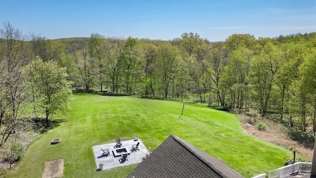 drone / aerial view featuring a forest view