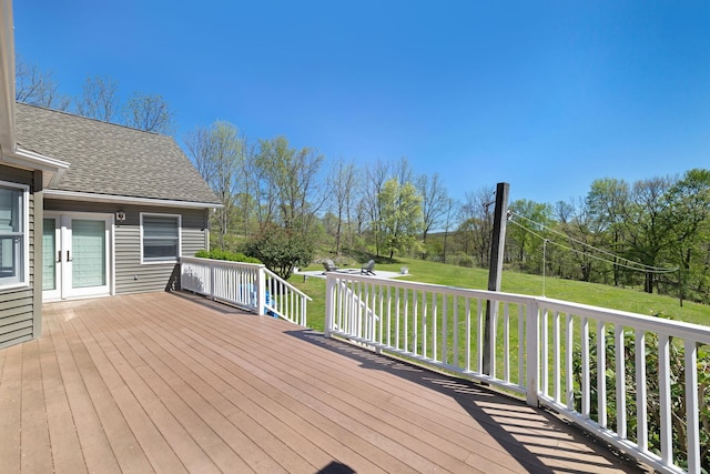 wooden terrace with a yard