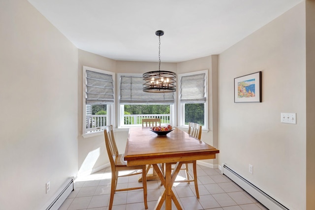 dining space with a notable chandelier, light tile patterned floors, and baseboard heating