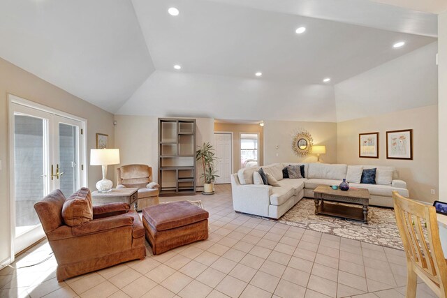 living room featuring light tile patterned floors, recessed lighting, and lofted ceiling