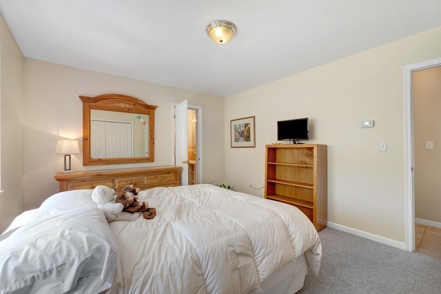 bedroom featuring baseboards and carpet flooring