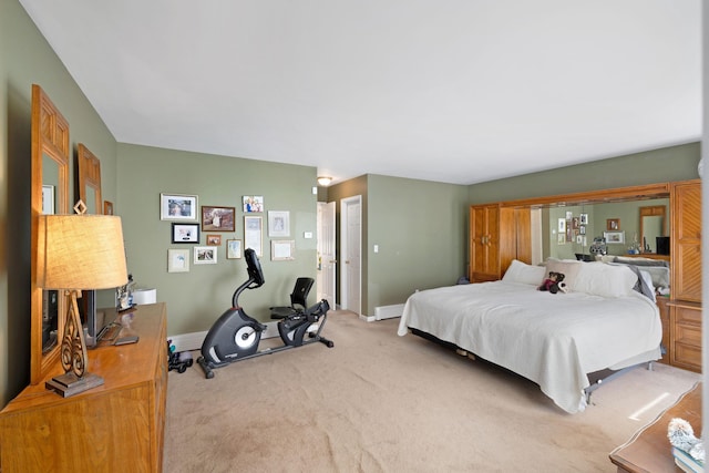 carpeted bedroom with baseboards