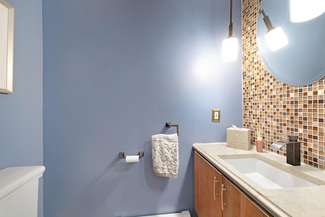 bathroom with toilet and vanity