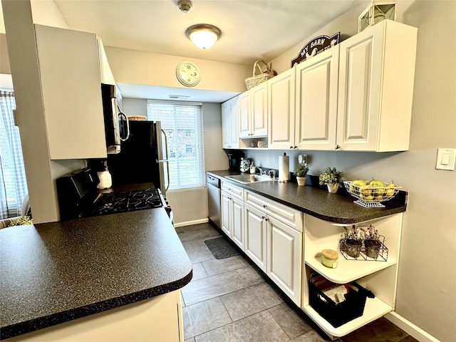23 Kiowa Ct Unit 23, Coram, NY 11727 - kitchen with open shelves, dark countertops, a sink, appliances with stainless steel finishes, and white cabinetry