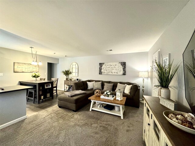 23 Kiowa Ct Unit 23, Coram, NY 11727 - carpeted living room with baseboards and visible vents
