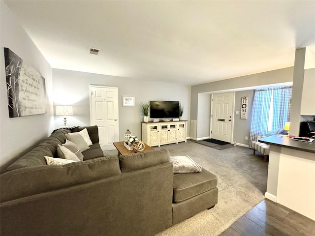 23 Kiowa Ct Unit 23, Coram, NY 11727 - living area featuring baseboards, visible vents, and dark wood finished floors