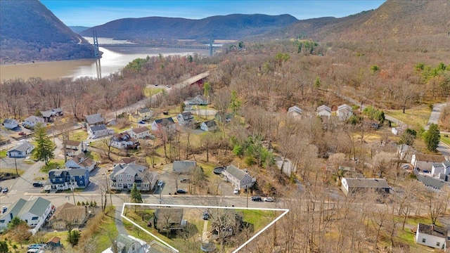 birds eye view of property featuring a water and mountain view and a residential view