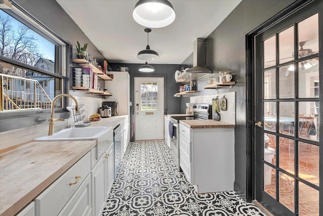kitchen with ventilation hood, a sink, electric range, backsplash, and open shelves