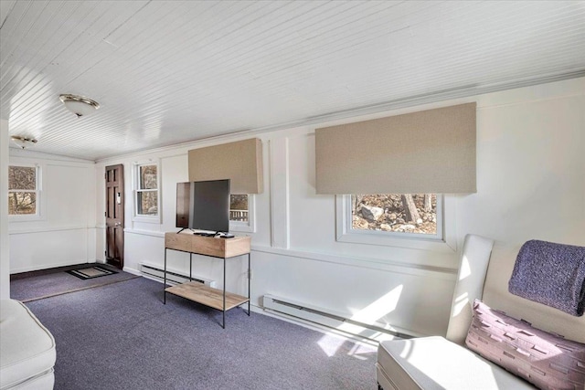 living room with a baseboard heating unit, carpet flooring, and wood ceiling