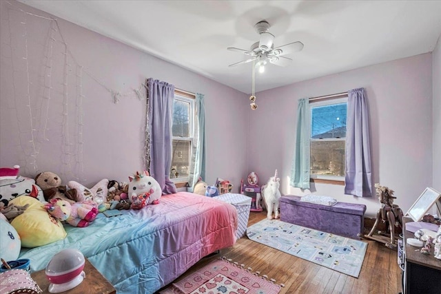 bedroom featuring wood-type flooring and ceiling fan