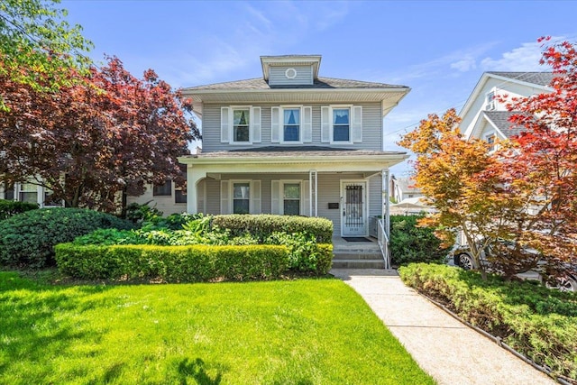 35-30 211th St, Bayside, NY 11361 - traditional style home featuring a porch and a front lawn