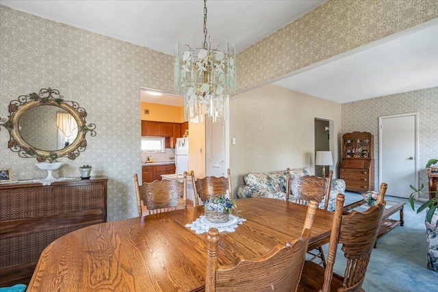 35-30 211th St, Bayside, NY 11361 - dining room featuring wallpapered walls, a chandelier, and carpet floors