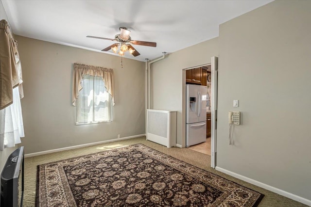 35-30 211th St, Bayside, NY 11361 - spare room with light carpet, a ceiling fan, and baseboards