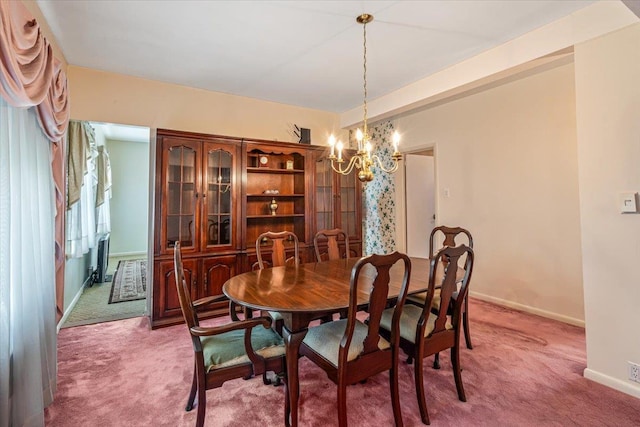 35-30 211th St, Bayside, NY 11361 - dining room featuring light carpet, a chandelier, and baseboards