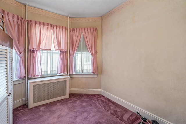 35-30 211th St, Bayside, NY 11361 - spare room featuring radiator, baseboards, and carpet