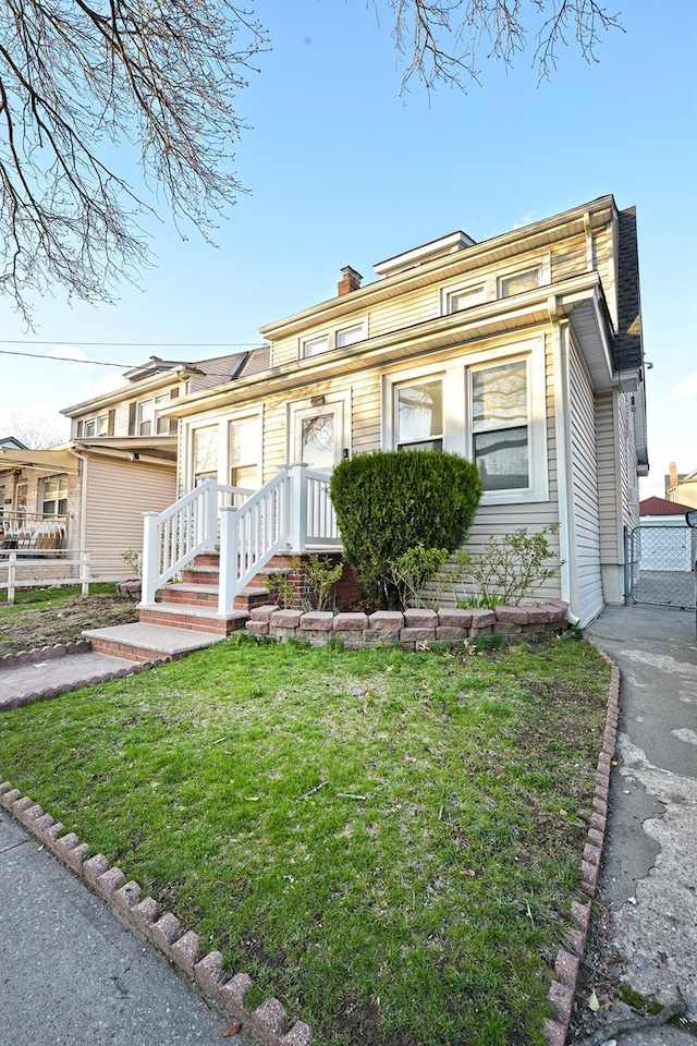 9249 Springfield Blvd, Queens Village, NY 11428 - view of front of home featuring a chimney