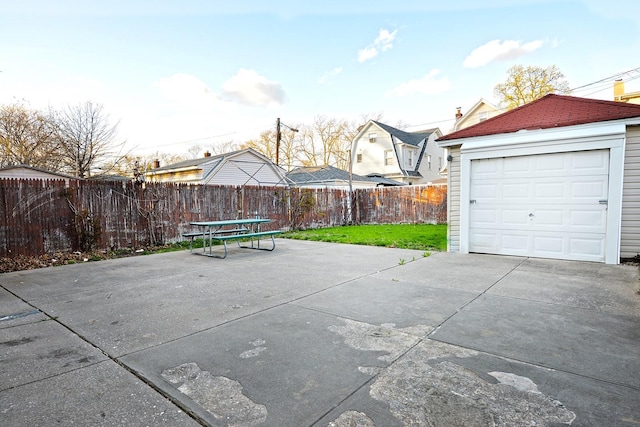 9249 Springfield Blvd, Queens Village, NY 11428 - view of patio / terrace featuring driveway and an outbuilding