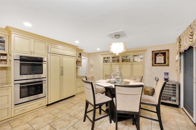 dining space featuring recessed lighting and a notable chandelier