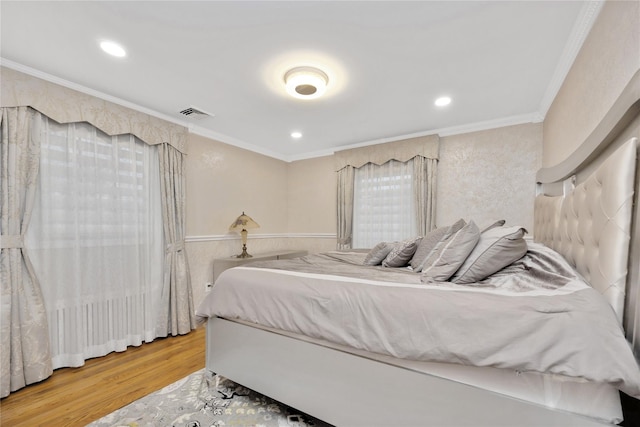 bedroom featuring crown molding, recessed lighting, wood finished floors, and visible vents